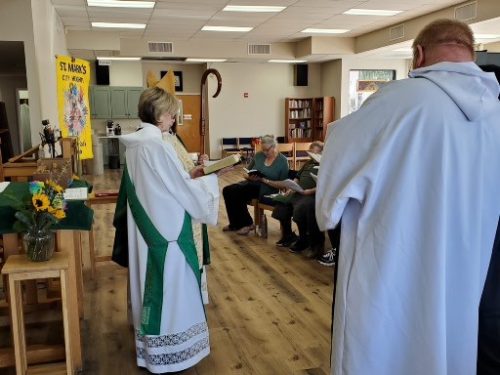 Archdeacon Cindy Campos and Fr. Richard in remodeled worship space